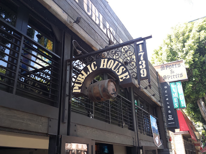 1739 Public House exterior sign on Vermont Avenue with pool and games signage