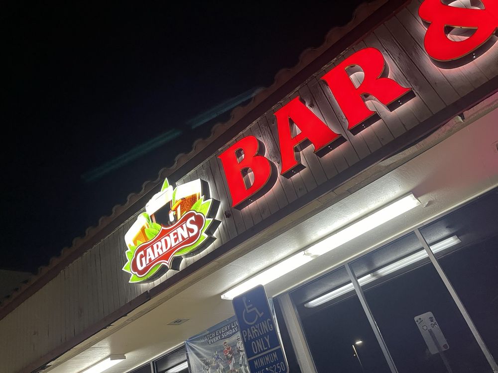 Gardens Bar and Grill neon sign at night in La Habra
