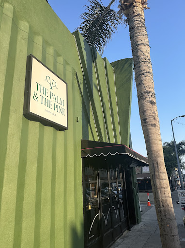 The Palm & The Pine sign on the green art-deco facade in Hollywood