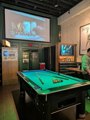 Coin-op pool table with custom green felt at The Palm & The Pine in Hollywood